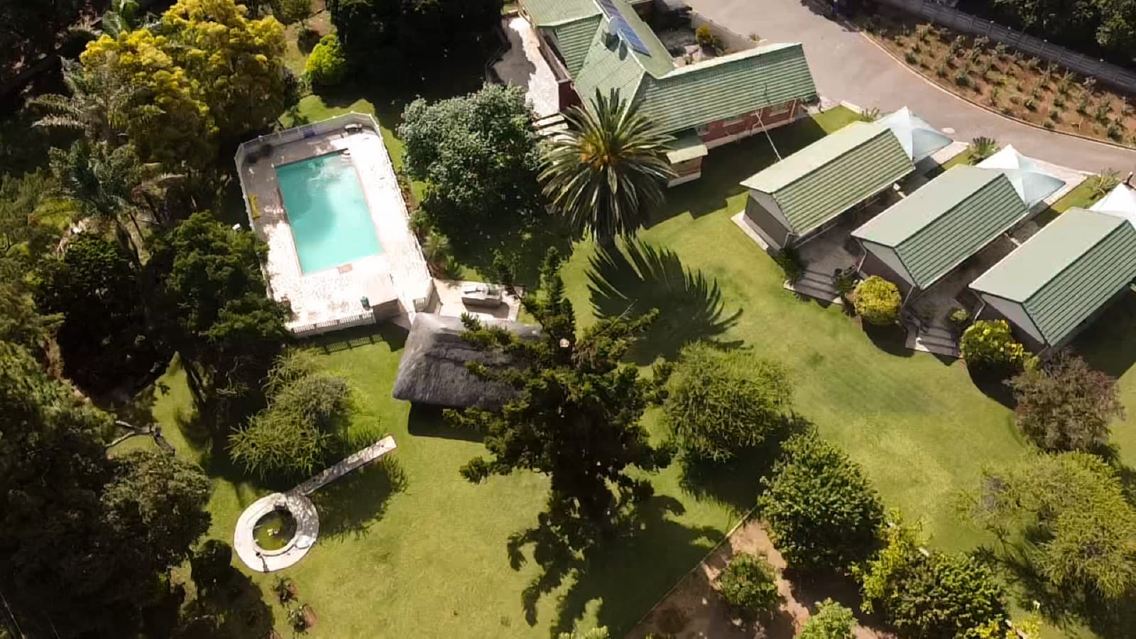 Aerial view of Villa Thabiso's swimming pool, gardens and chalets in Hillside, Bulawayo